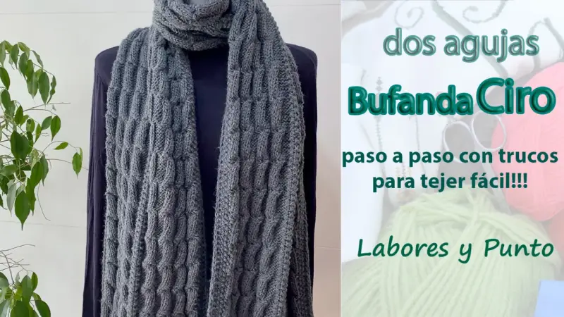 Bufanda punto gris con textura de trenzas, ideal para aprender a tejer fácil.